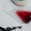 Catch & Release Wines 2022 Lite Weight wine color in glass next to bottle