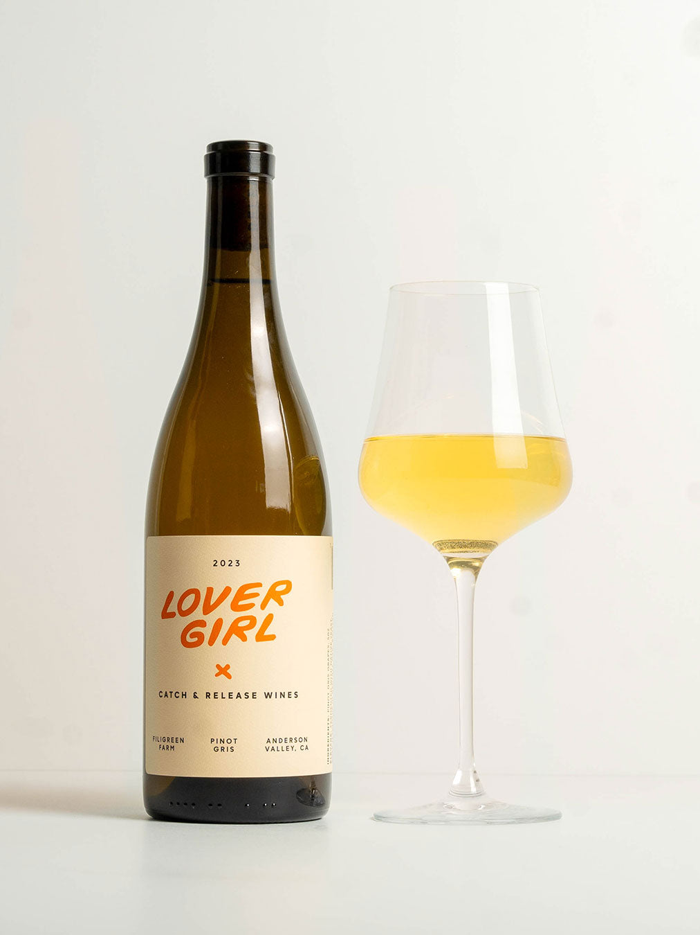 Catch & Release Natural Wine biodynamically farmed Pinot Gris bottle shot with glass of wine poured