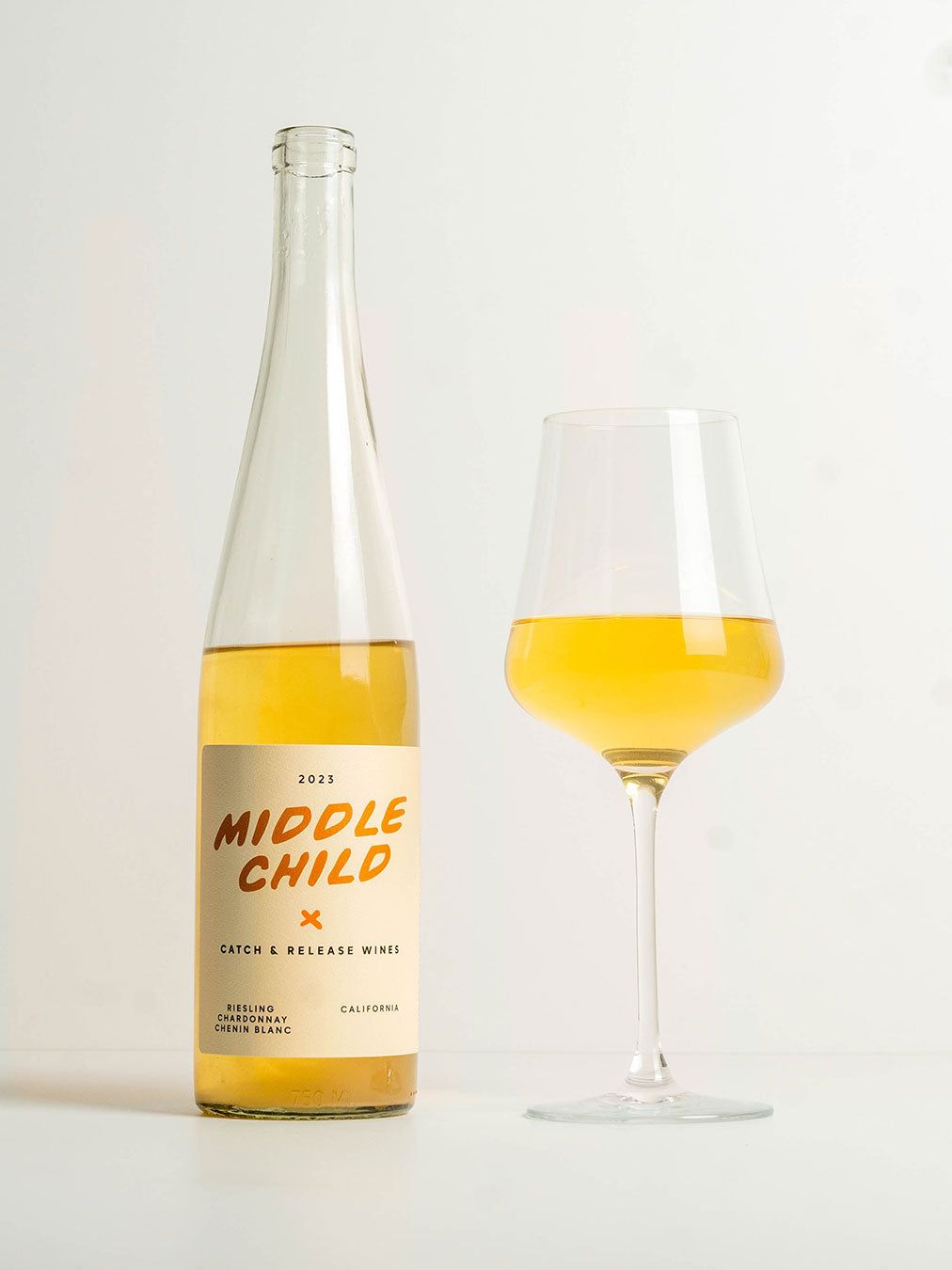 Catch & Release California Natural Wine skin-contact Riesling 2023 Middle Child bottle with poured glass of wine next to it