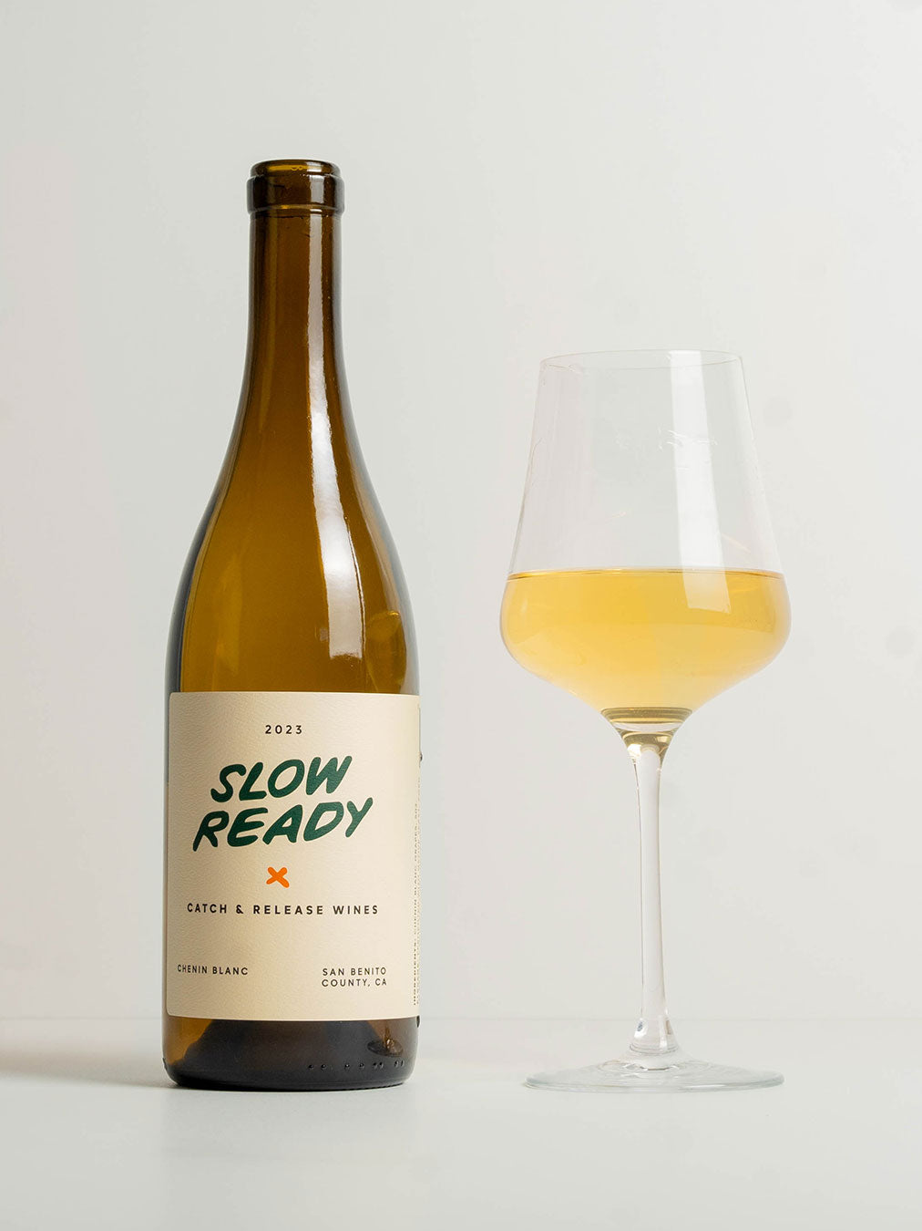 Catch & Release Natural Wine Slow Ready California Chenin Blanc bottle with glass of wine next to it