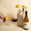 Catch & Release Natural Wine Slow Ready Chenin Blanc bottle, gift tote and glasses of wine next to it