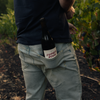 Catch & Release California Natural Wine Supernova Gamay bottle in winemaker's back pocket in vineyard