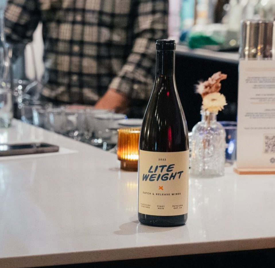 2022 Lite Weight Pinot Noir bottle on a bar