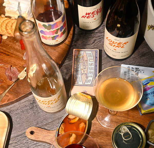 Catch & Release Natural California Wine table with appetizers including cheese, crackers, and canned fish
